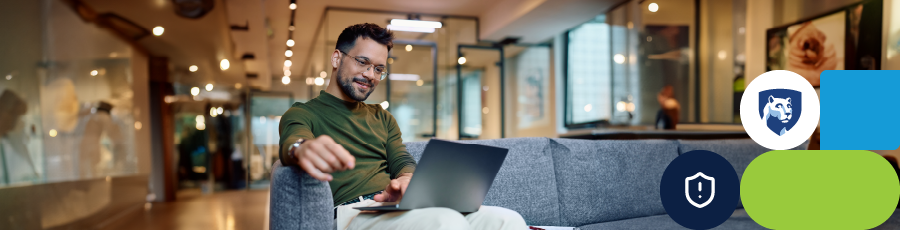 Individual sitting on a couch, working on a laptop with a notepad beside them.

