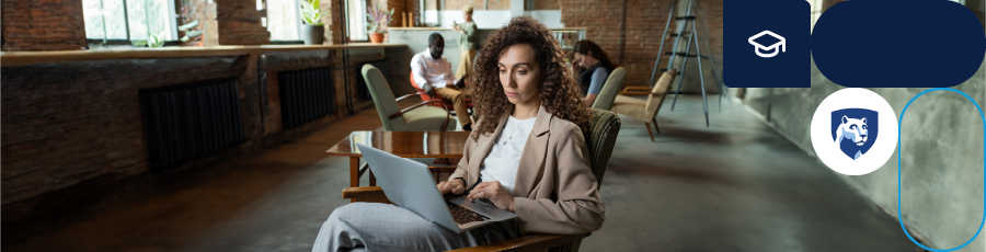 Person with a laptop in a workspace.

