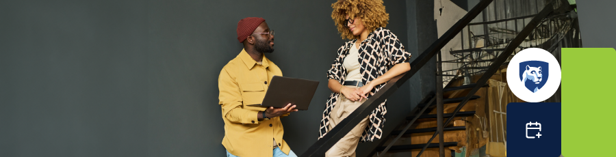 Two individuals standing on a staircase, one holding a laptop and the other with a brown bag.